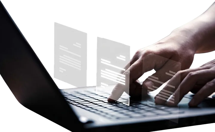 Hands on a laptop keyboard, with document pages rising off the screen.